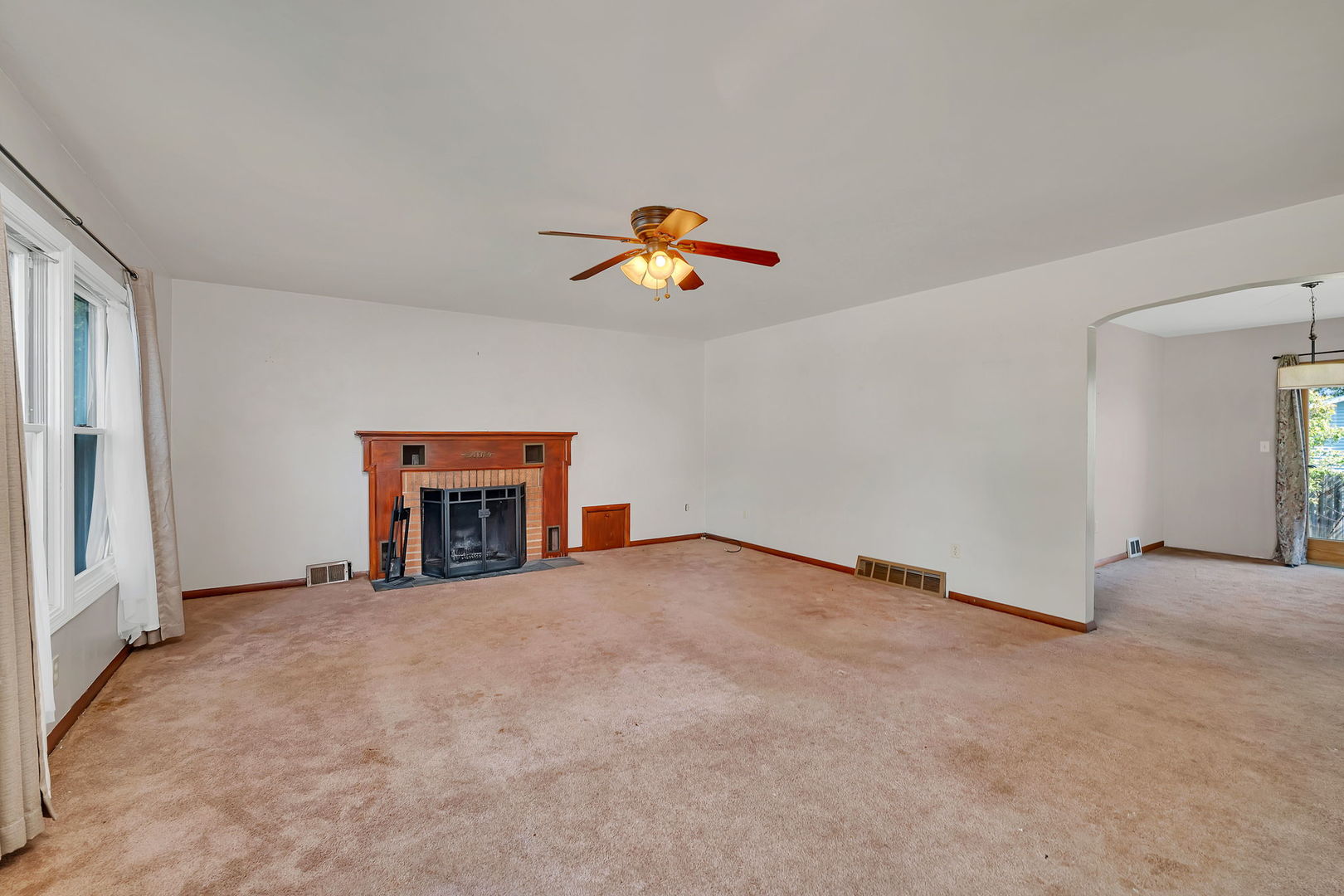 536 Fort Street Ottawa, IL 61350 - Photo 5 of 30 an empty room with fireplace and window