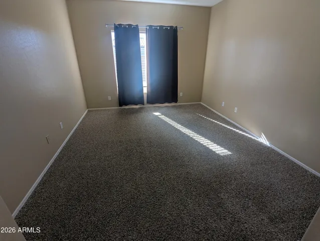 a bathroom with a granite countertop sink a mirror and shower