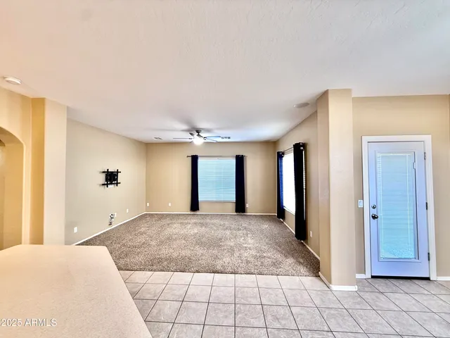 a view of a big room with closet and windows