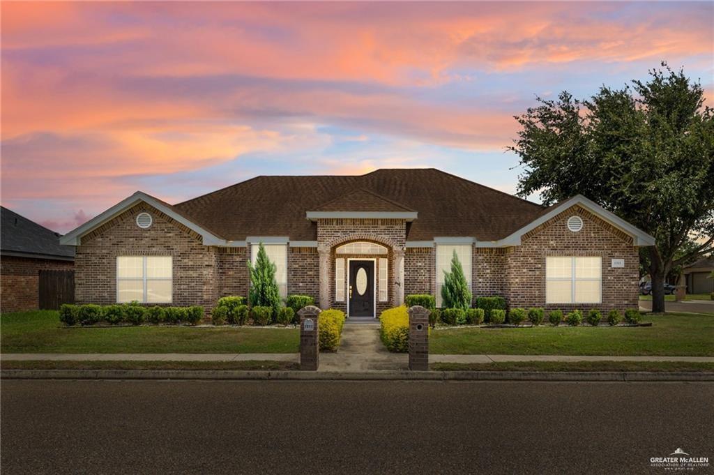 1311 East 28th Street Mission, TX 78574 - Photo 1 of 19 a front view of a house with a garden