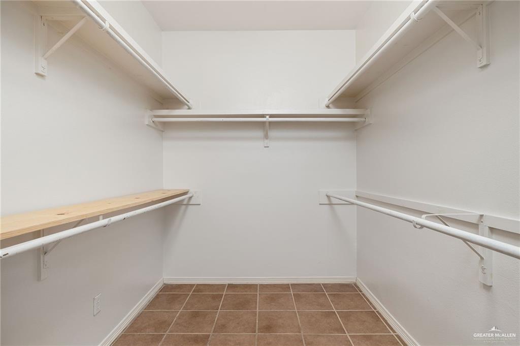 1311 East 28th Street Mission, TX 78574 - Photo 13 of 19 a view of a room with racks on the wall