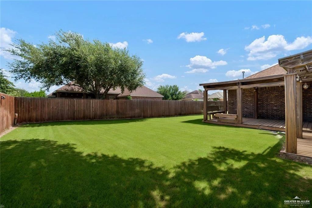 1311 East 28th Street Mission, TX 78574 - Photo 18 of 19 a view of a backyard with a garden and entertaining space