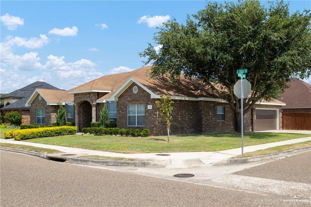 1311 East 28th Street Mission, TX 78574 - Photo 3 of 19 a front view of a house with a yard and garage