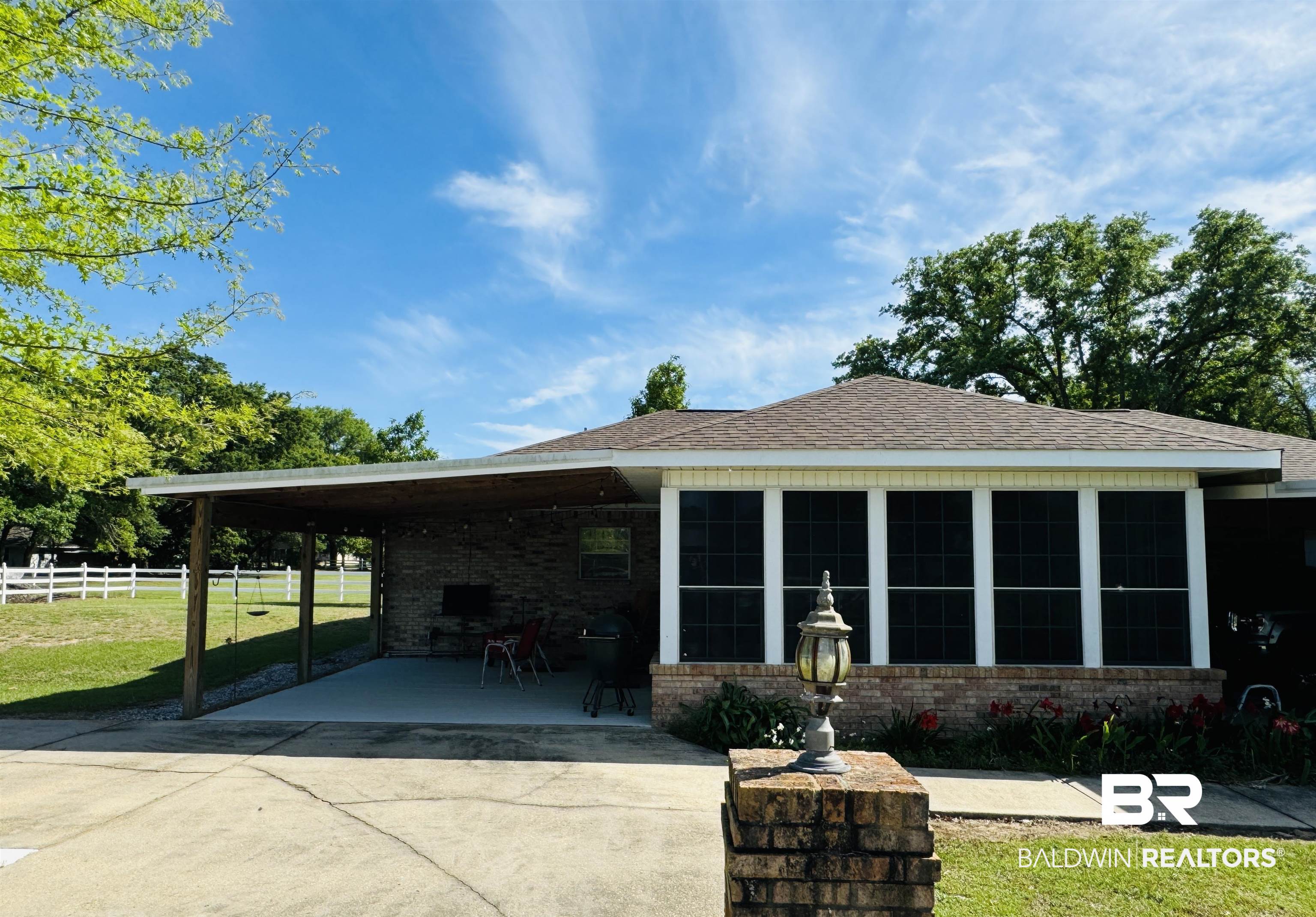13795 White Road Silverhill, AL 36576 - Photo 55 of 99 Rear view of property featuring brick siding, an attached carport, a shingled roof, a patio area, and driveway