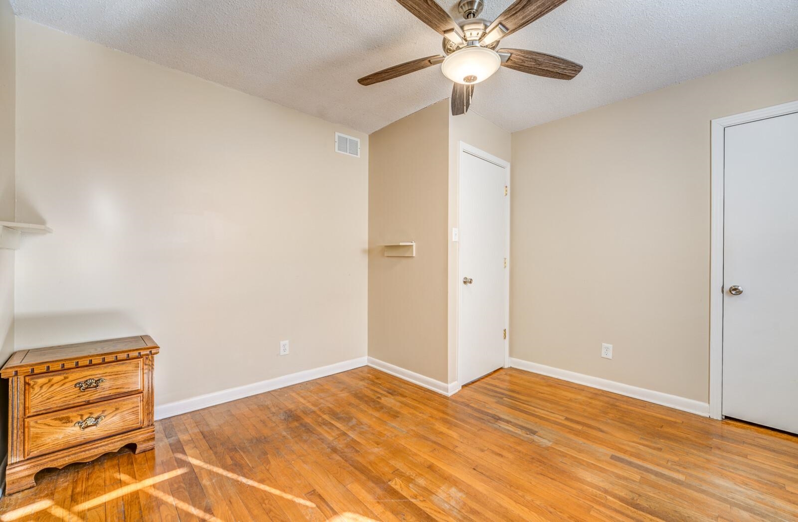 11060 Memphis Arlington Road Arlington, TN 38002 - Photo 12 of 25 a view of an empty room and wooden floor