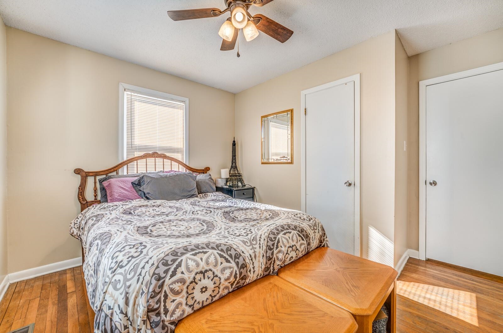 11060 Memphis Arlington Road Arlington, TN 38002 - Photo 13 of 25 a bedroom with a bed and a chandelier