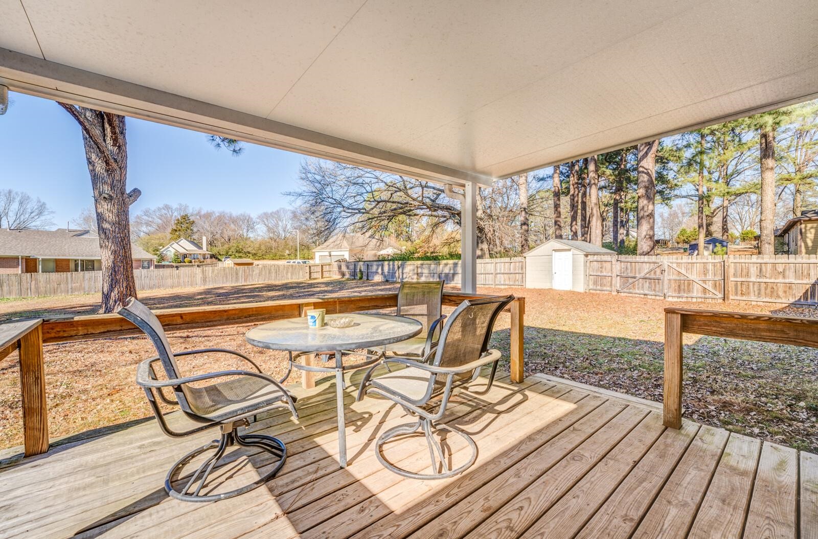 11060 Memphis Arlington Road Arlington, TN 38002 - Photo 17 of 25 a view of a balcony with chairs and wooden floor