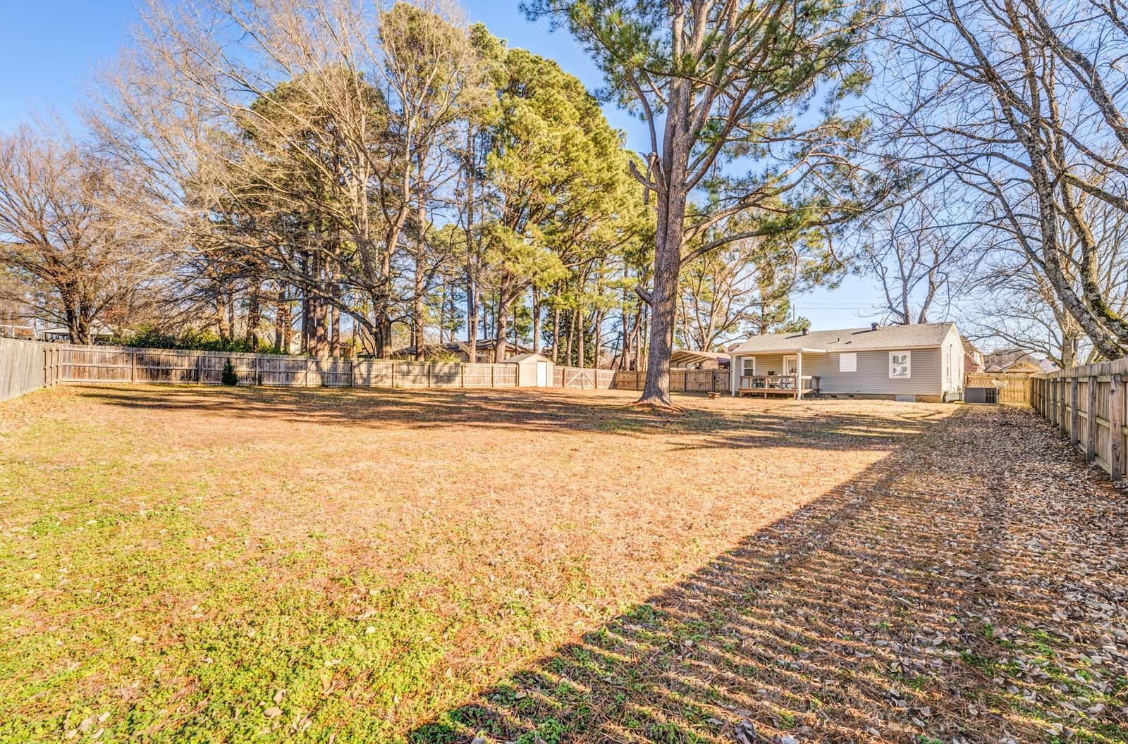 11060 Memphis Arlington Road Arlington, TN 38002 - Photo 23 of 25 a house with trees in front of it