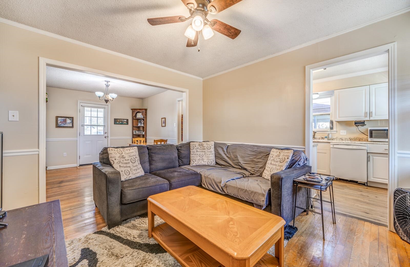 11060 Memphis Arlington Road Arlington, TN 38002 - Photo 7 of 25 a living room with furniture and a wooden floor