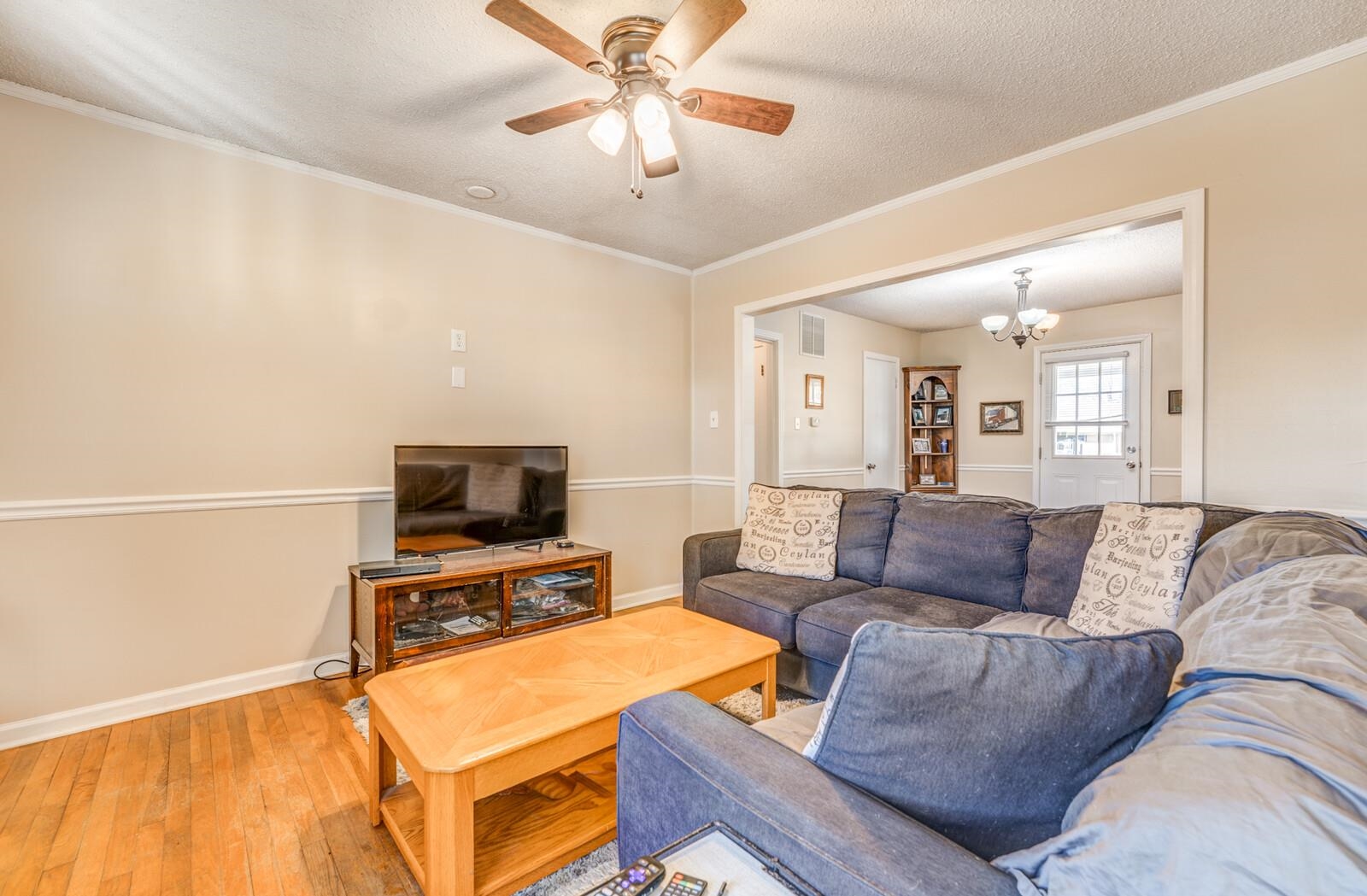 11060 Memphis Arlington Road Arlington, TN 38002 - Photo 8 of 25 a living room with furniture and a flat screen tv