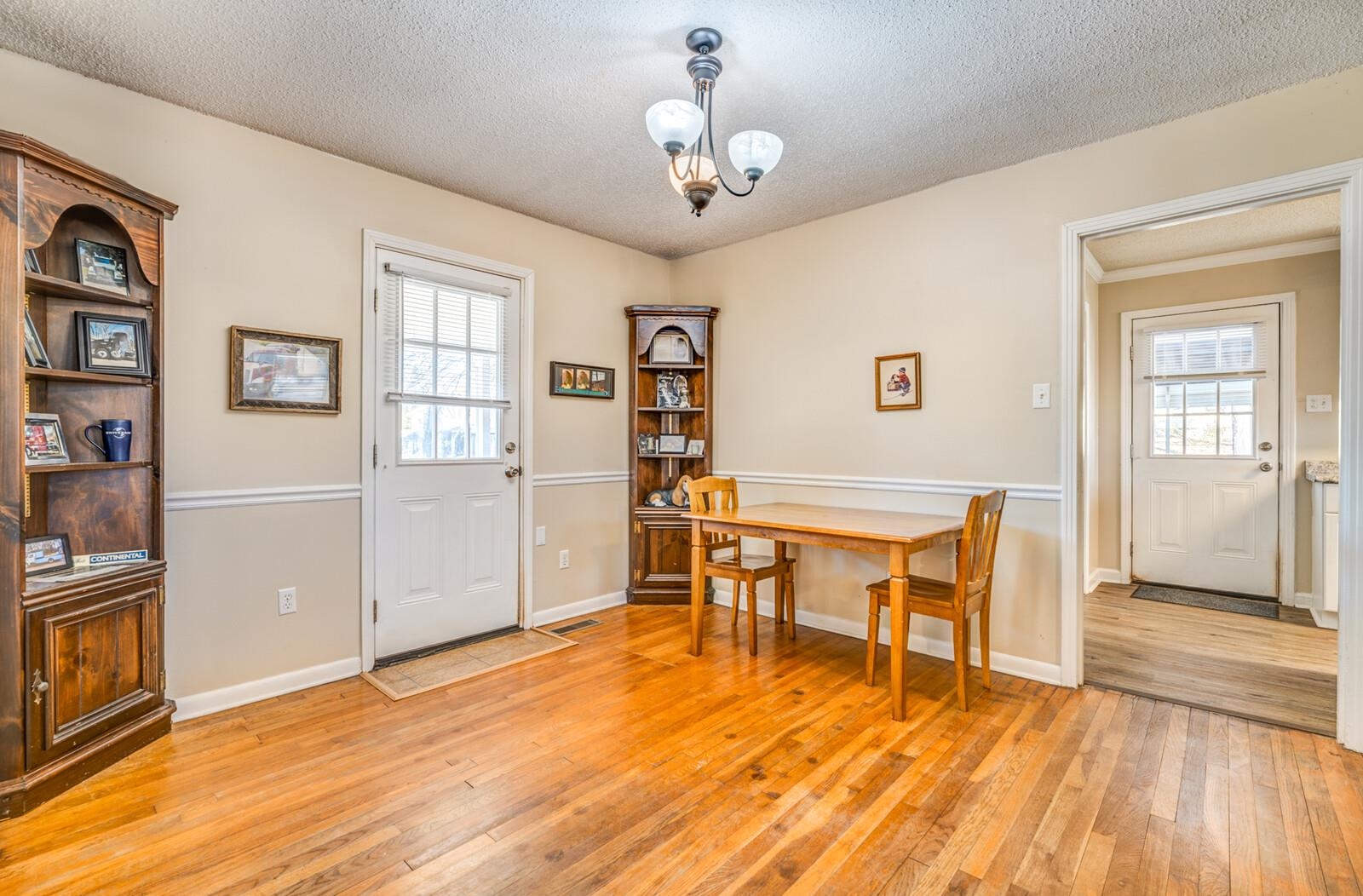 11060 Memphis Arlington Road Arlington, TN 38002 - Photo 10 of 25 a workspace room with wooden floor fireplace and window