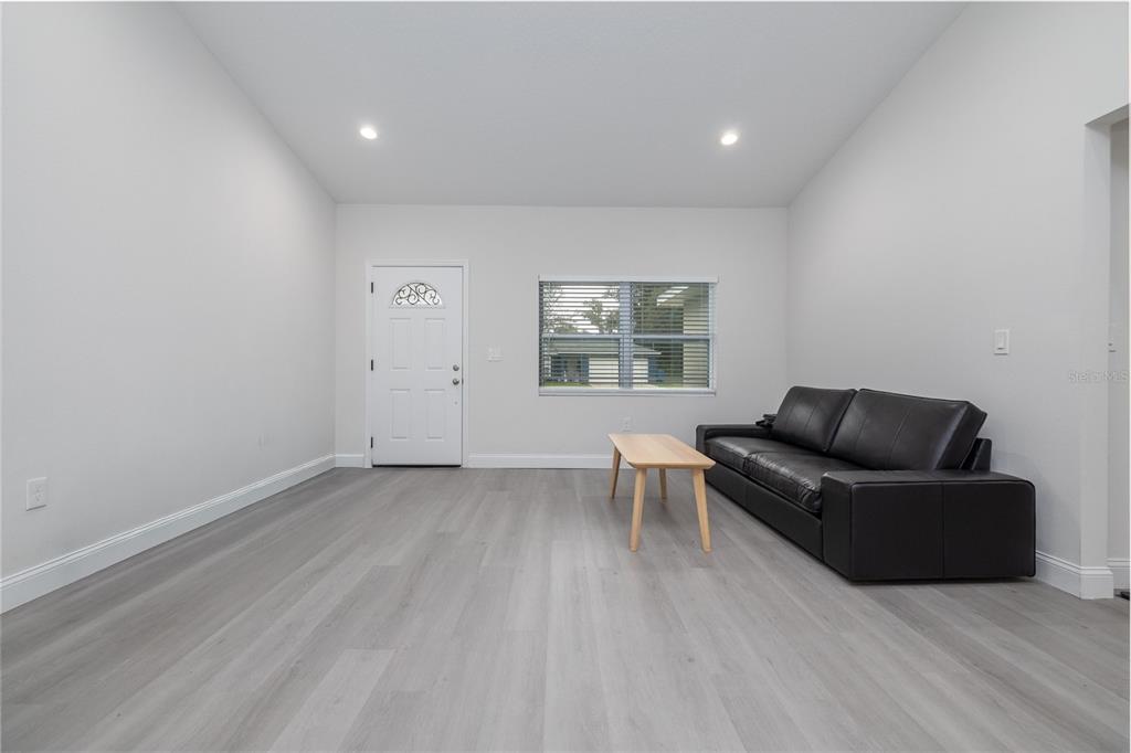 1171 9th Street Orange City, FL 32763 - Photo 12 of 27 a living room with furniture and a window