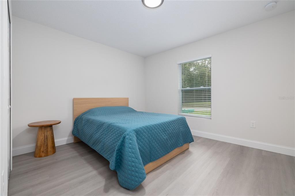 1171 9th Street Orange City, FL 32763 - Photo 20 of 27 a bedroom with a bed and a window