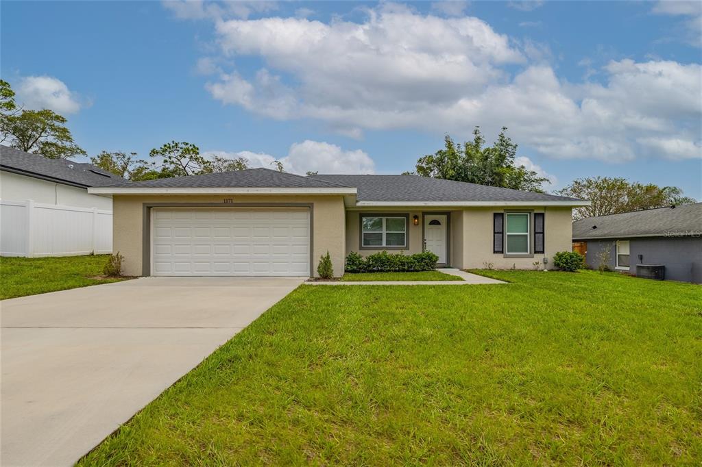 1171 9th Street Orange City, FL 32763 - Photo 2 of 27 a view of a house with a back yard
