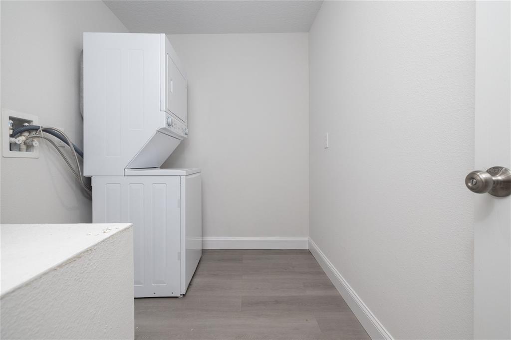 1171 9th Street Orange City, FL 32763 - Photo 22 of 27 a view of walk in closet with washer and dryer