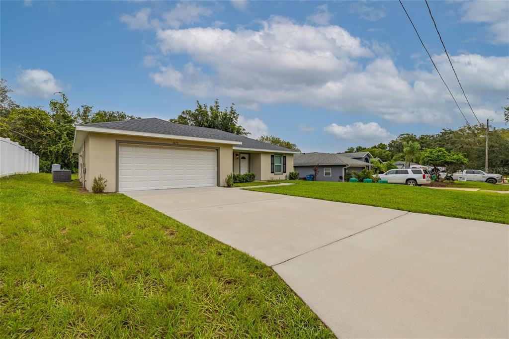 1171 9th Street Orange City, FL 32763 - Photo 4 of 27 a front view of house with yard and green space