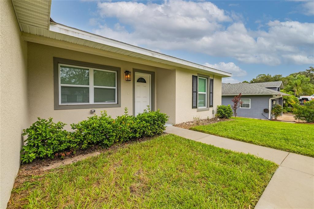 1171 9th Street Orange City, FL 32763 - Photo 6 of 27 front view of a house with a yard