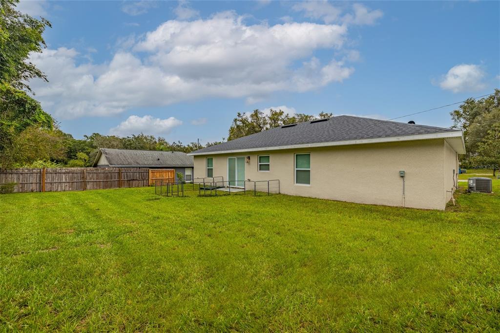 1171 9th Street Orange City, FL 32763 - Photo 8 of 27 a view of a house with backyard and garden