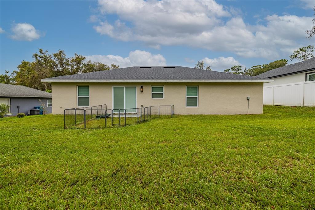1171 9th Street Orange City, FL 32763 - Photo 9 of 27 a front view of house with yard and trees