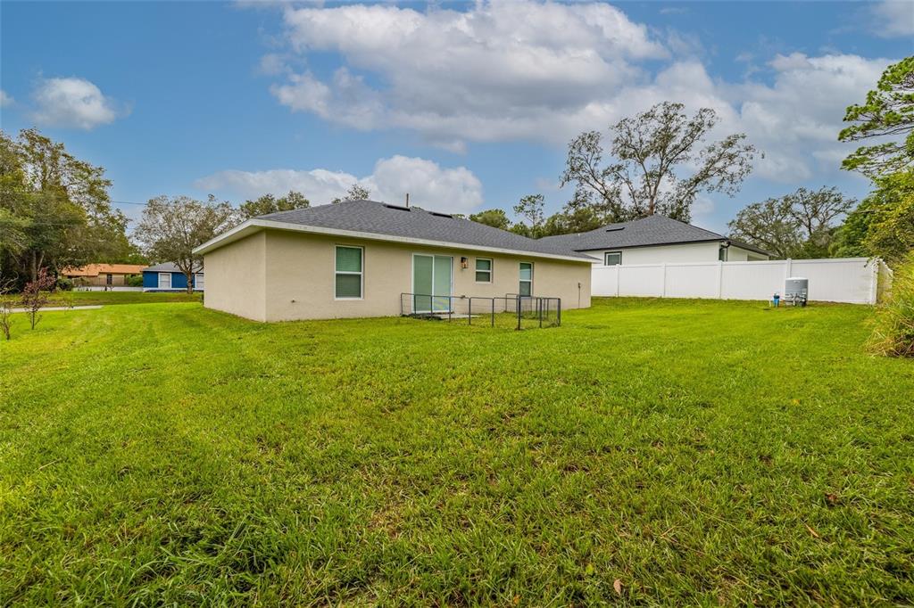1171 9th Street Orange City, FL 32763 - Photo 10 of 27 a view of a house with a yard