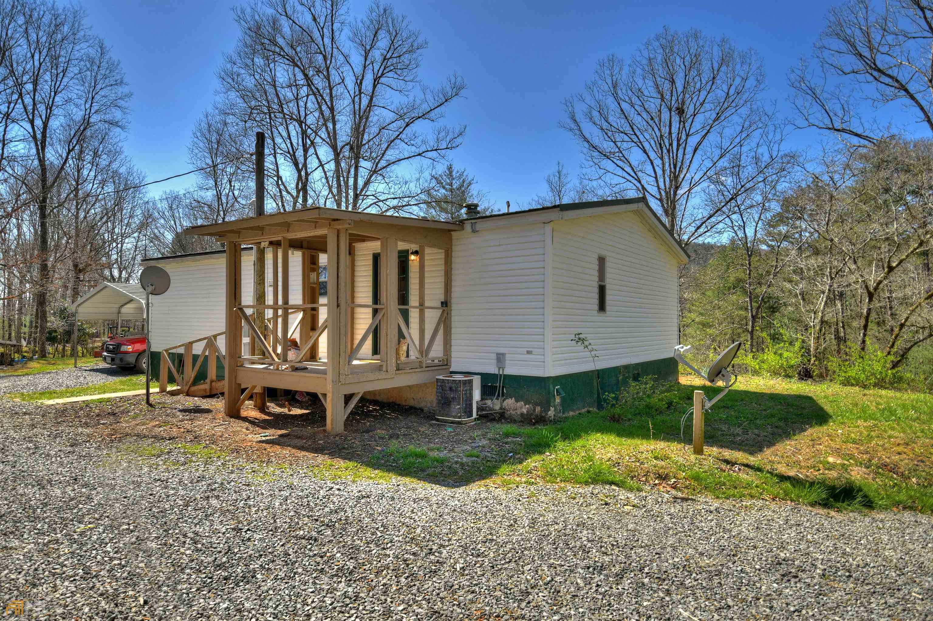 135 Adrian Court Ellijay, GA 30540 - Photo 1 of 1 a front view of a house with garden
