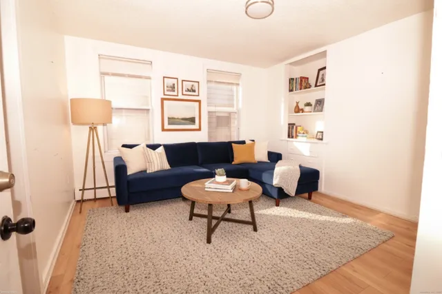 a living room with furniture and a rug
