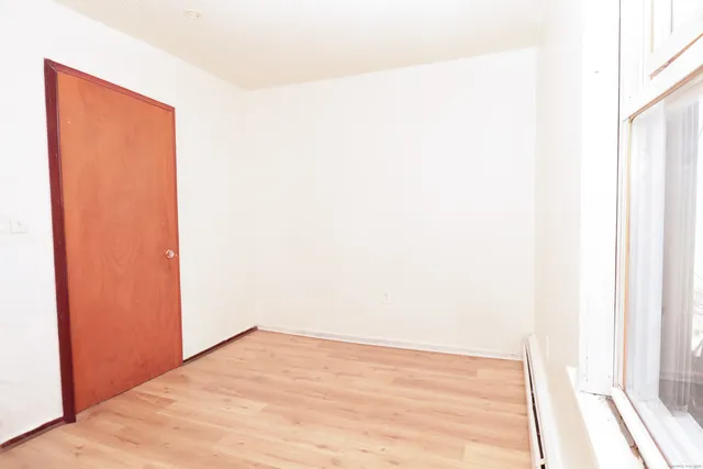 a view of a white house with a sink and table and chairs