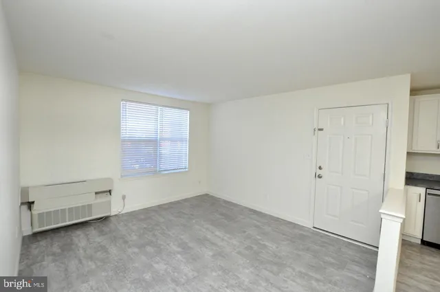 a view of an empty room and entryway