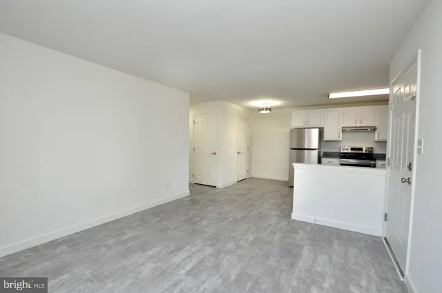 a view of kitchen with refrigerator sink and microwave