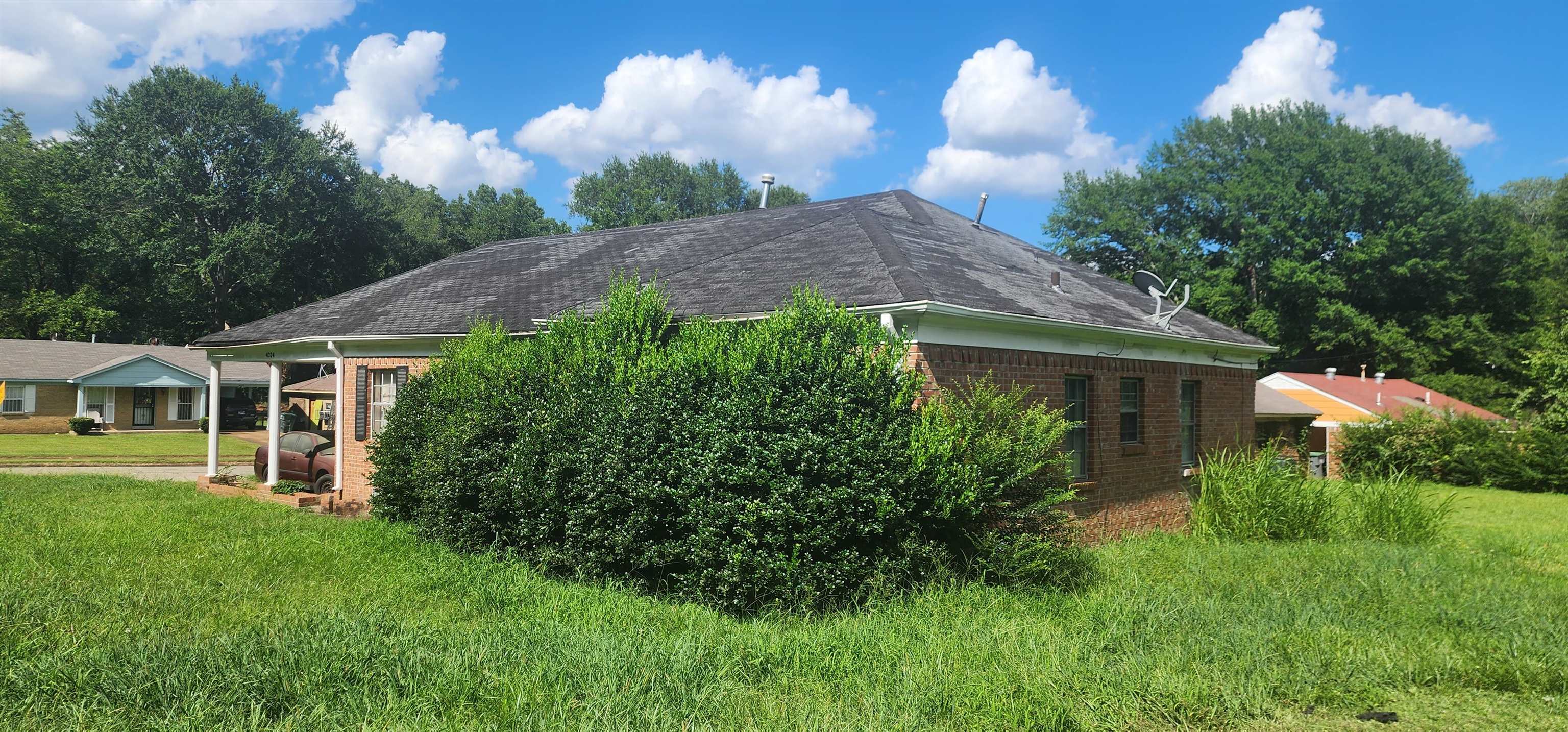4324 Prescott Road Memphis, TN 38118 - Photo 6 of 7 a view of a house with a yard and a garden