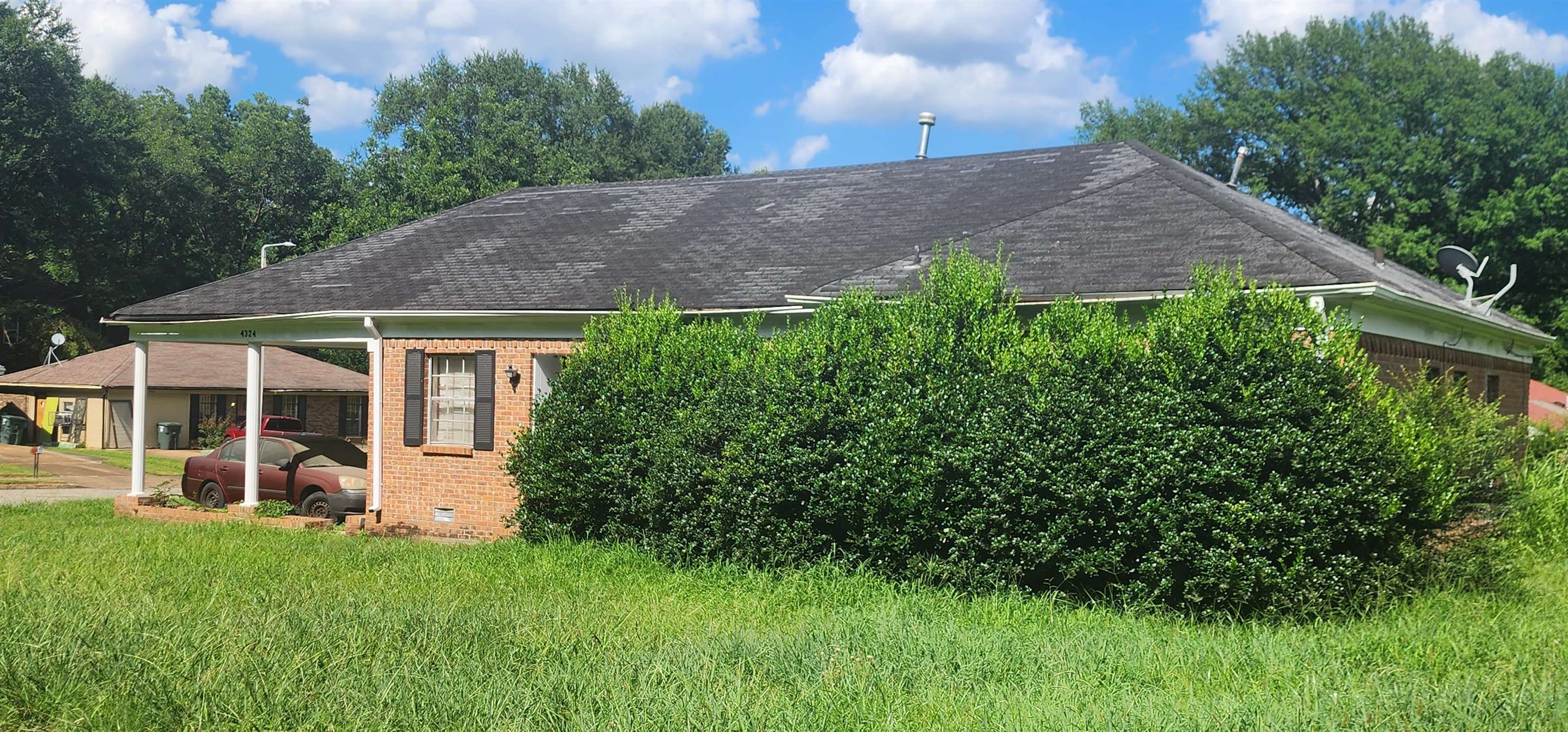 4324 Prescott Road Memphis, TN 38118 - Photo 7 of 7 a view of a house with a yard and potted plants