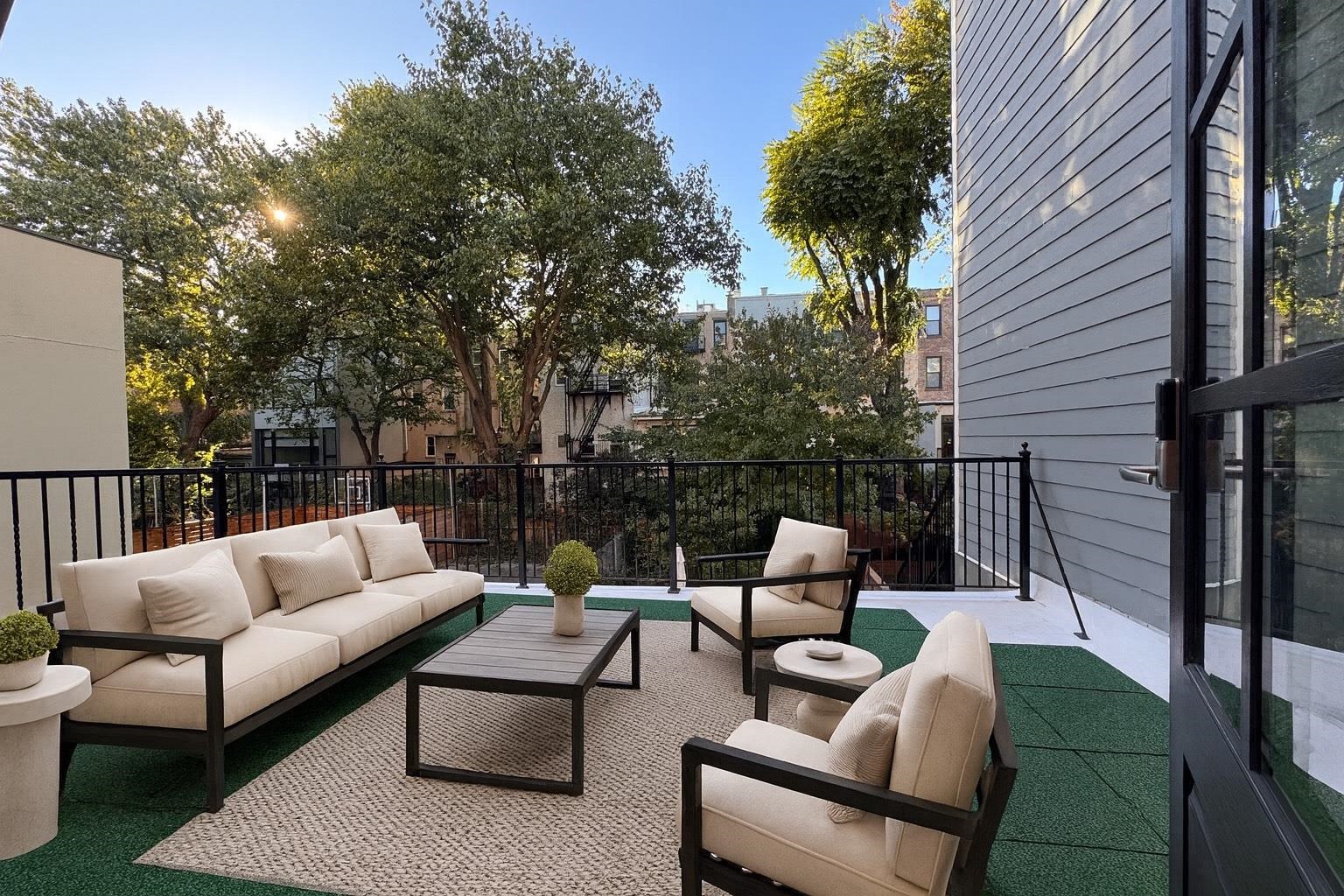 1028 Bloomfield Street, Unit 2 Hoboken, NJ 07030 - Photo 5 of 6 a view of a patio with couches table and chairs and potted plants