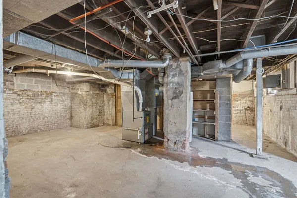 a view of empty room with wooden walls
