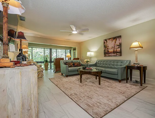 a kitchen with granite countertop white cabinets stainless steel appliances and a sink