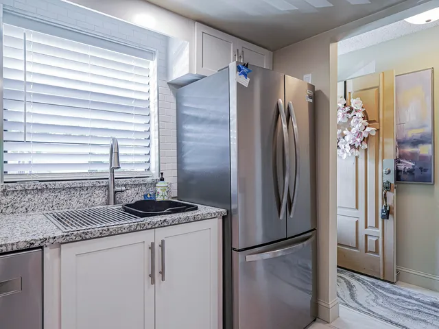 a living room with furniture a chandelier