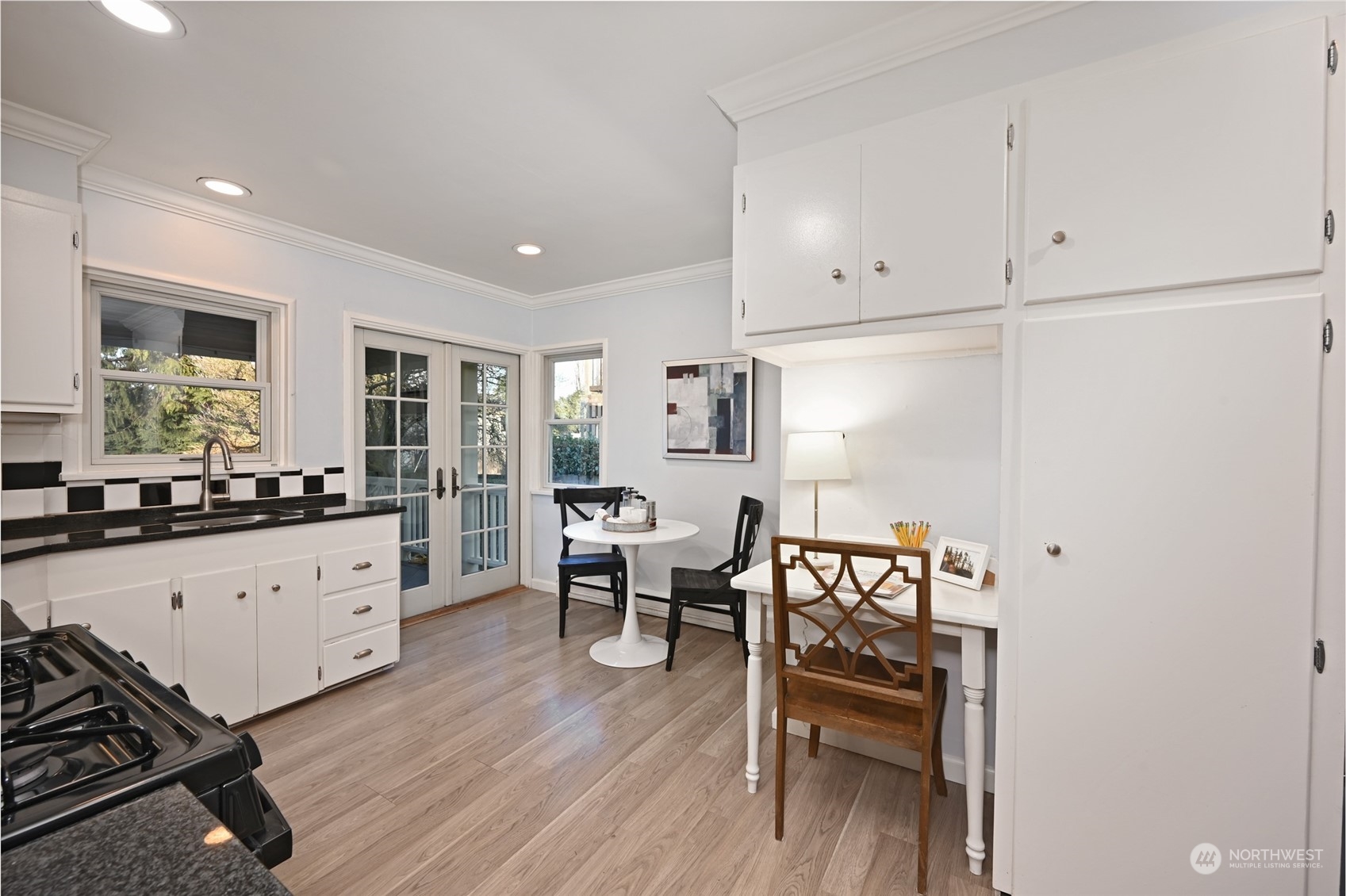 312 Northeast 95th Street Seattle, WA 98115 - Photo 13 of 37 a large white kitchen with cabinets