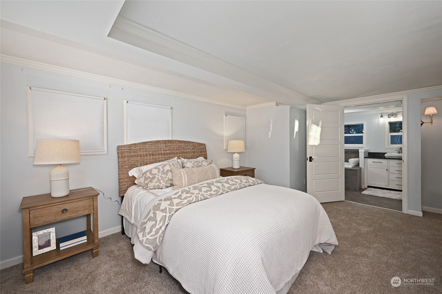 312 Northeast 95th Street Seattle, WA 98115 - Photo 22 of 37 a spacious bedroom with a bed and a couch