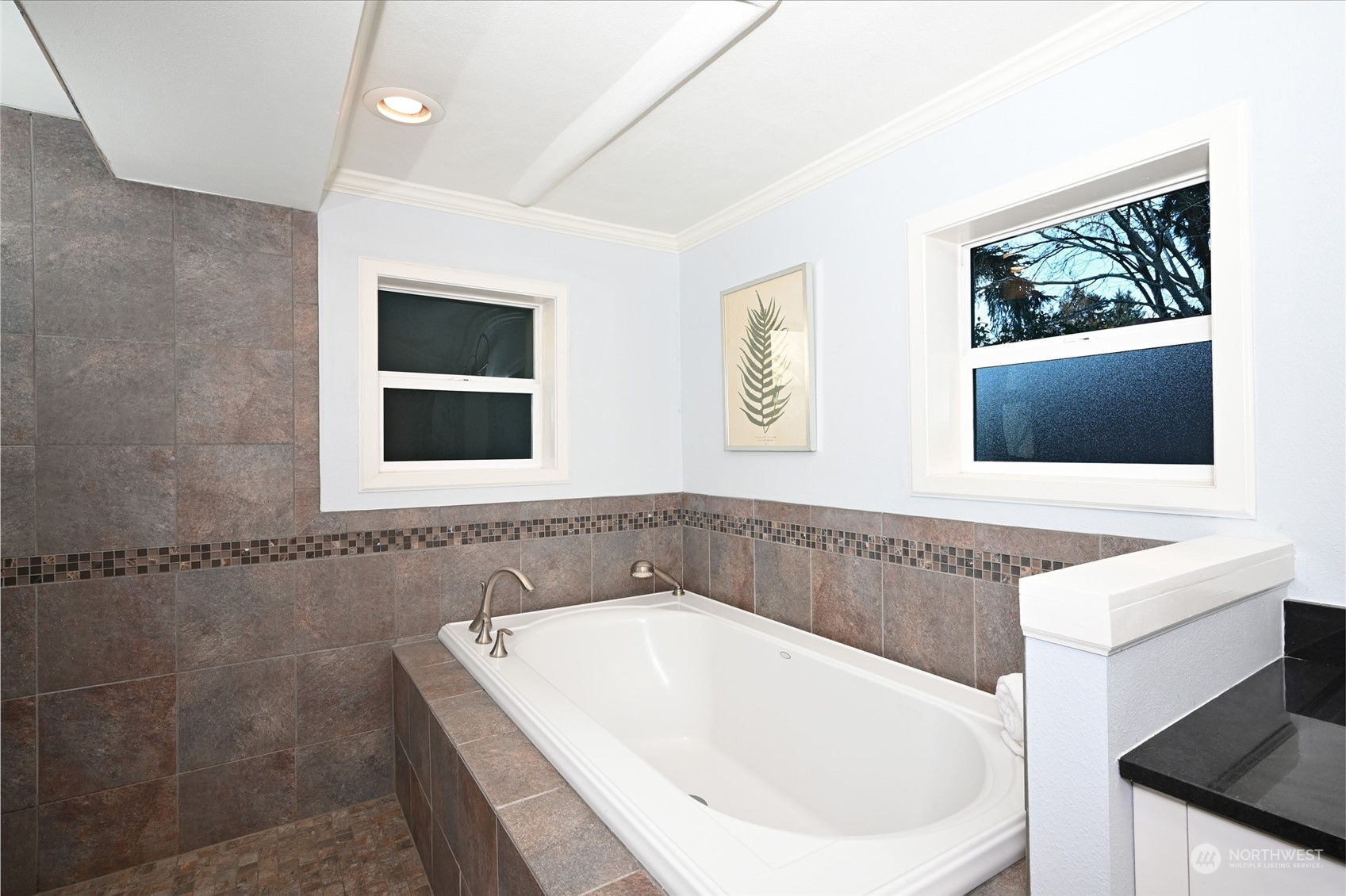 312 Northeast 95th Street Seattle, WA 98115 - Photo 25 of 37 a bathroom with a tub a sink and mirror