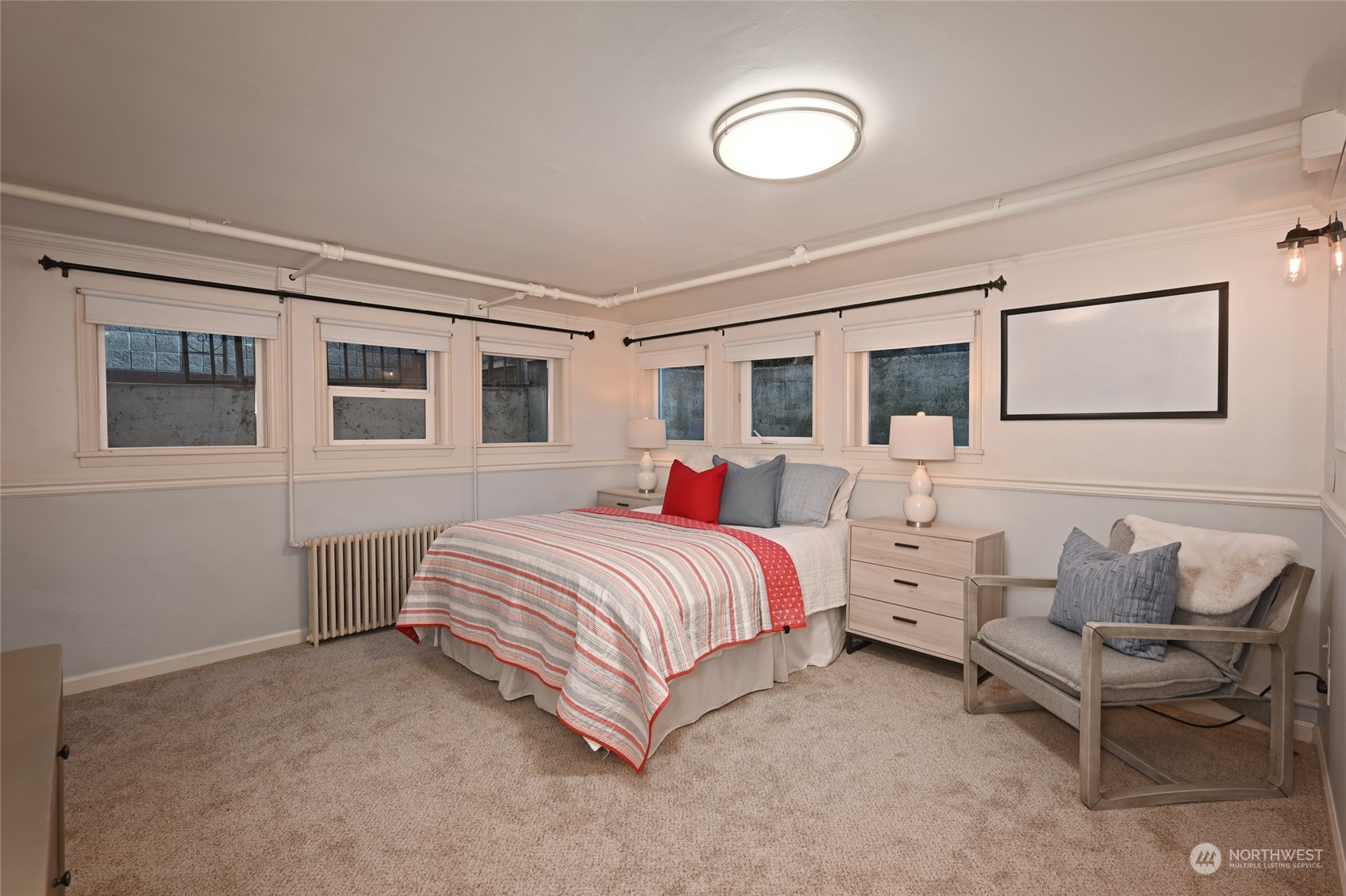 312 Northeast 95th Street Seattle, WA 98115 - Photo 28 of 37 a spacious bedroom with a bed and window
