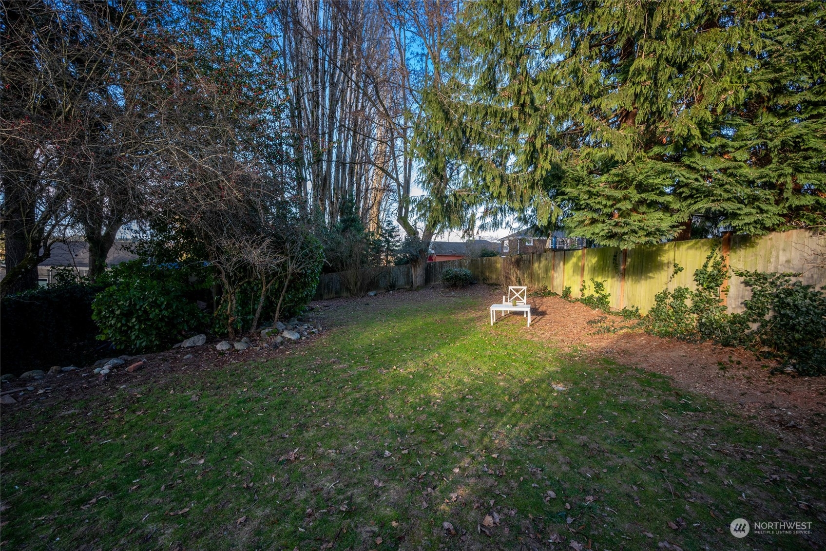 312 Northeast 95th Street Seattle, WA 98115 - Photo 32 of 37 a lake view with a bench