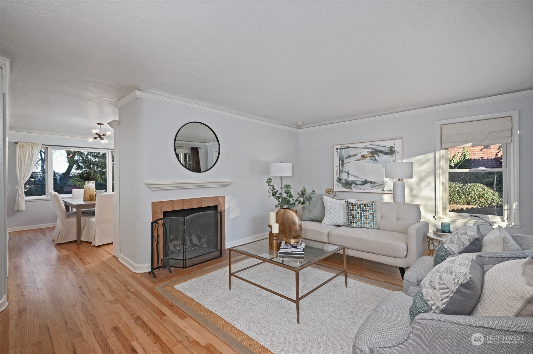 312 Northeast 95th Street Seattle, WA 98115 - Photo 8 of 37 a living room with furniture a window and a fireplace