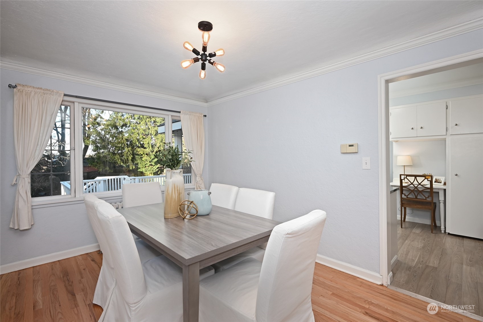 312 Northeast 95th Street Seattle, WA 98115 - Photo 10 of 37 a view of a dining room with furniture window and wooden floor