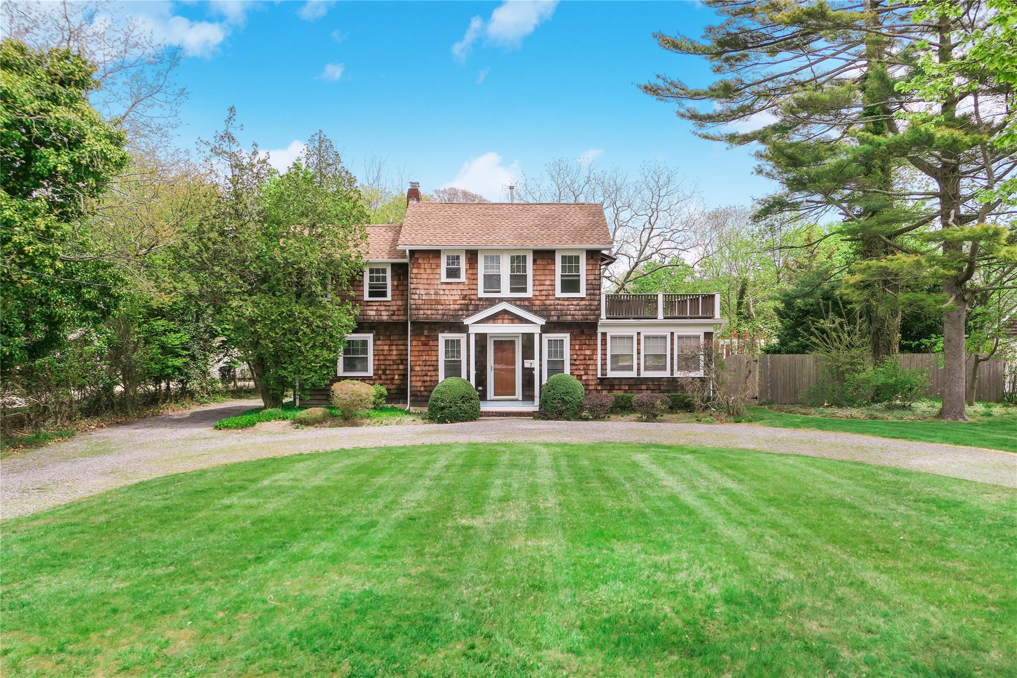 7 North Howells Point Road Bellport, NY 11713 - Photo 1 of 1 a front view of a house with a yard