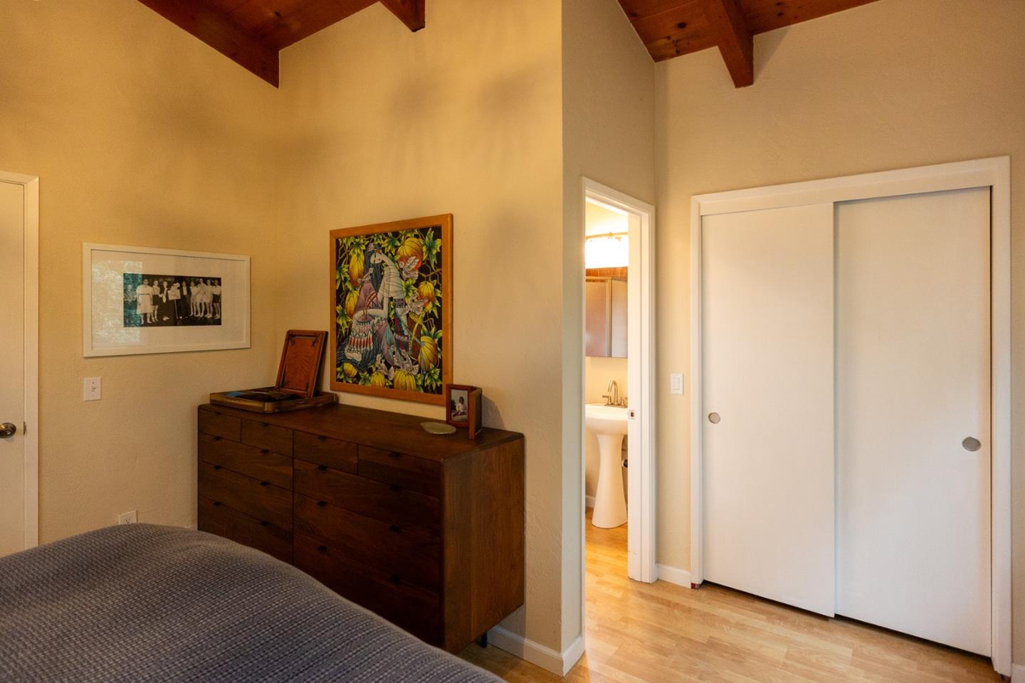779 Alice Street Monterey, CA 93940 - Photo 13 of 27 a bedroom with a bed and wooden floor