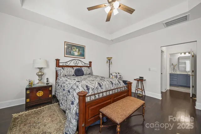 a bedroom with a bed and a table in it