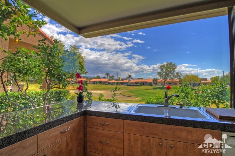 a view of a yard with an outdoor seating