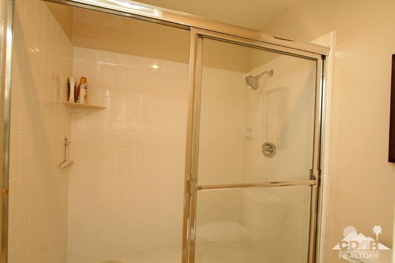 56 Oak Tree Drive Rancho Mirage, CA 92270 - Photo 21 of 32 a bathroom with a shower
