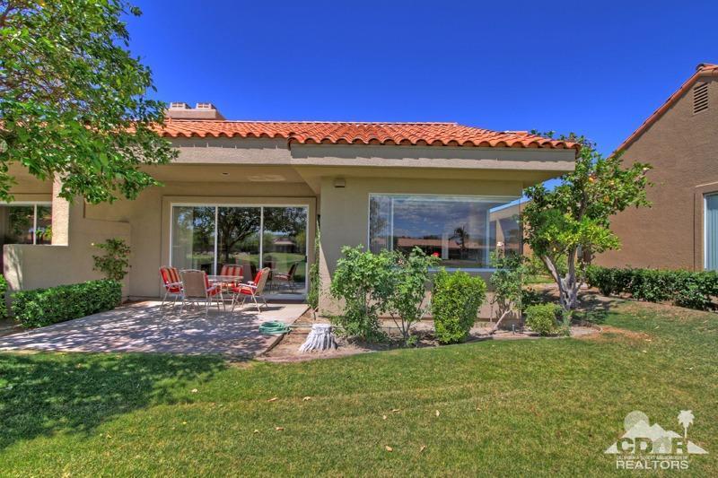 56 Oak Tree Drive Rancho Mirage, CA 92270 - Photo 25 of 32 a view of a house with a yard