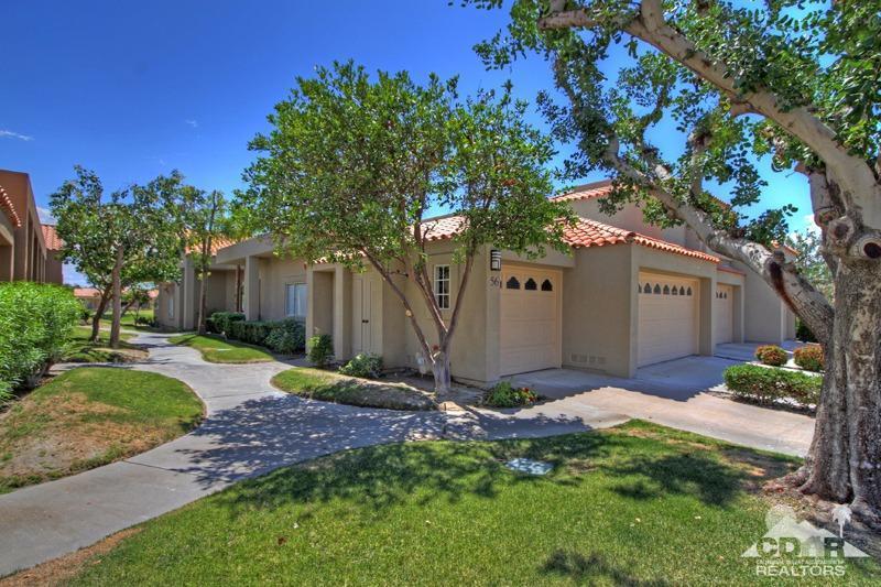 56 Oak Tree Drive Rancho Mirage, CA 92270 - Photo 27 of 32 a front view of a house with garden