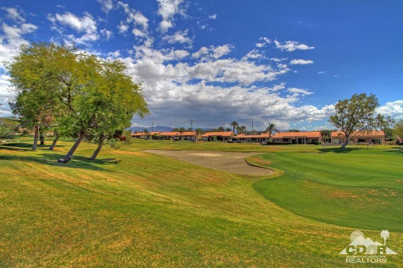 56 Oak Tree Drive Rancho Mirage, CA 92270 - Photo 30 of 32 a view of a swimming pool with an outdoor space and seating area